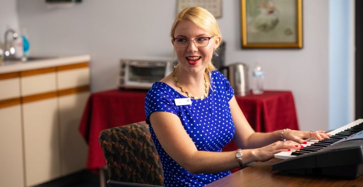 Woman playing a song on a keyboard