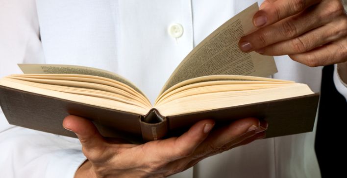 Hands holding a book