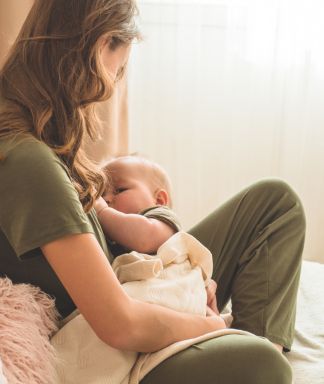 Woman nursing her infant