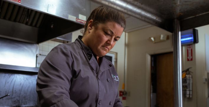 Female chef cooking in a kitchen