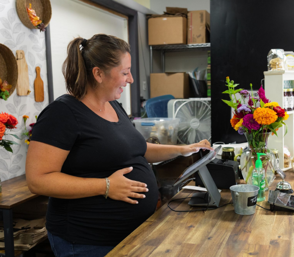 Pregnant woman with her hand on her stomach